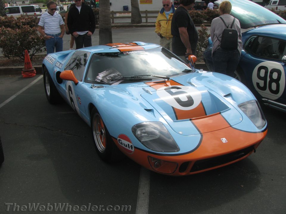 Light blue and orange Ford GT40 race car with number 6 on hood