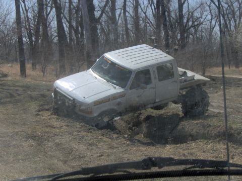 1992 Ford F-350 - This 1992 Ford F-350 is stuck deep in the mud off-road.