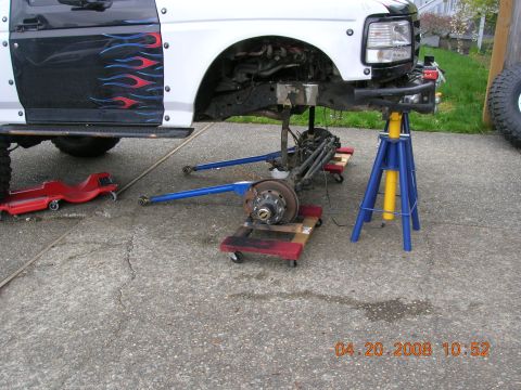 1996 Ford Bronco - Vehicle is on jack stands with front suspension removed for repairs. Date stamp reads 04.20.2008.