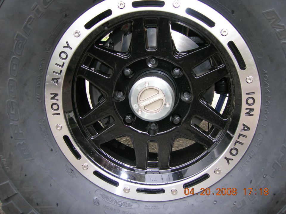 Black Ion Alloy wheel with silver trim and a BFGoodrich tire. Center cap reads Dynatrac. Date stamp visible