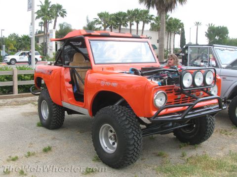 1968 Ford Mustang - This heavily modified off-road vehicle features a prominent roll cage and auxiliary lighting on the front bumper.