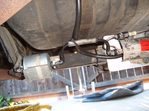 1973 Ford Ranchero - The fuel filter and pump assembly are visible on the underside of the vehicle, near the fuel tank.
