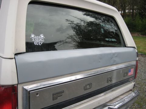 1980 Ford Bronco - Rear view of a white 1980 Ford Bronco with a 'BACK OFF' sticker on the rear window.