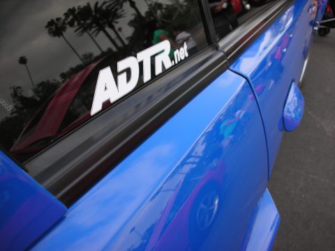 1992 Ford Crown Victoria - A blue car's side panel and window are shown, a prominent ADTR.net sticker.