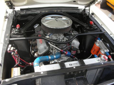 1992 Ford Crown Victoria - Close-up view of a modified V8 engine bay, showing various aftermarket parts and wiring.