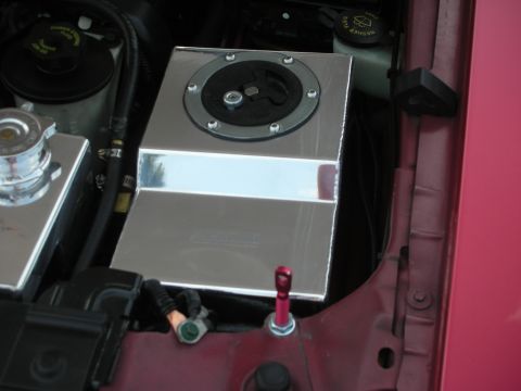 1992 Ford Crown Victoria - Close-up view of engine bay components, including polished metal reservoirs and various hoses.