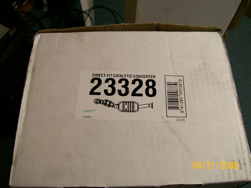 Boxed direct-fit catalytic converter part number 23328 with barcode label