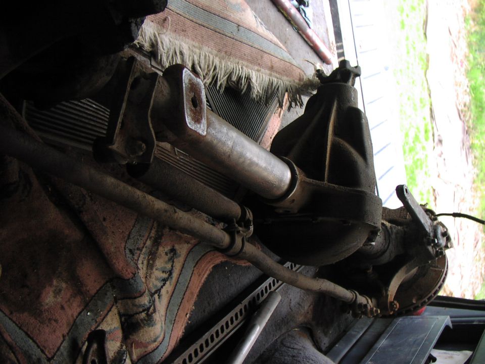 Rear axle assembly with leaf springs and suspension components, viewed from below