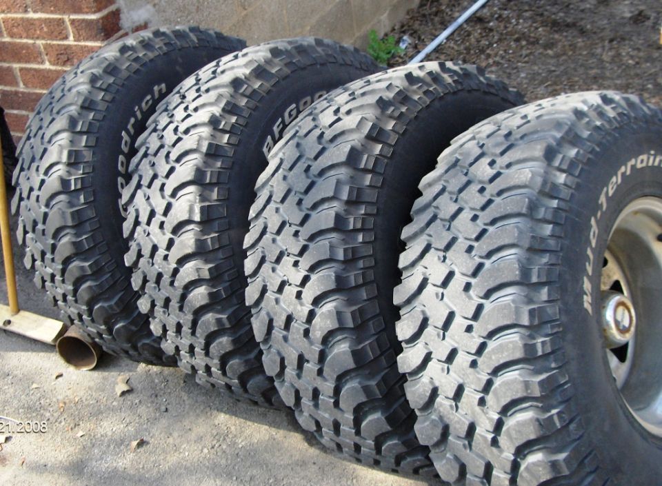 Four BFGoodrich Mud-Terrain tires lined up on the ground