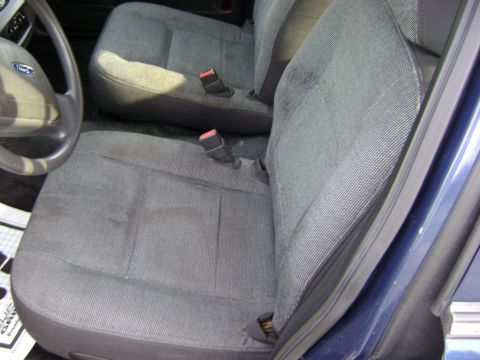 2001 Ford Crown Victoria - Interior view of a 2001 Ford Crown Victoria, showing the front seats and steering wheel.