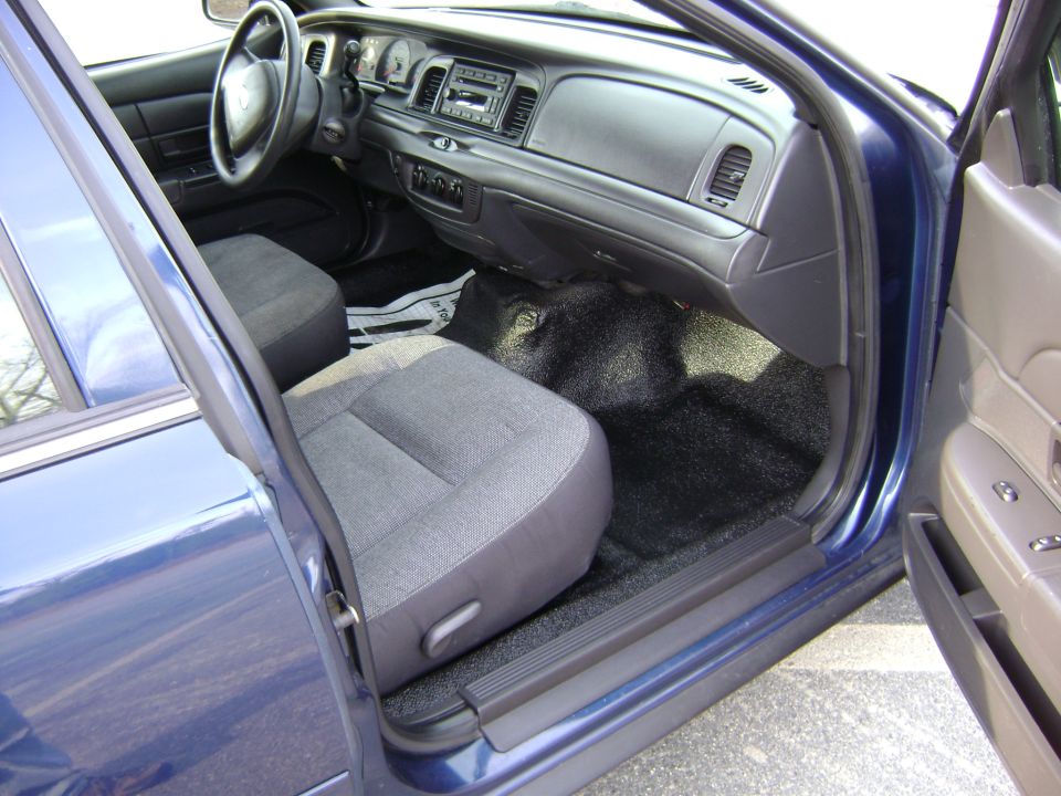 Blue 2001 Ford Crown Victoria interior with cloth seats and dashboard