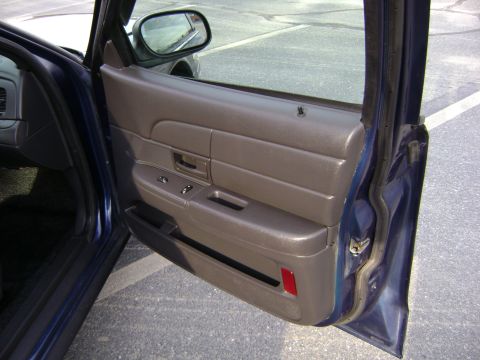 2001 Ford Crown Victoria - Interior view of the driver's side door panel on a 2001 Ford Crown Victoria.