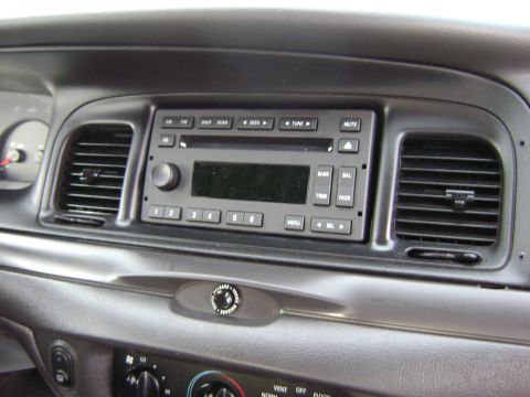 2001 Ford Crown Victoria - Interior view of a car's dashboard, showing the central console with audio controls and air vents.