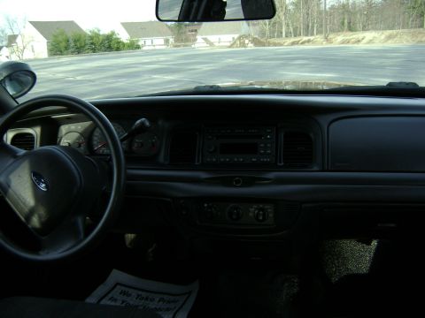 2001 Ford Crown Victoria - Interior view of a 2001 Ford Crown Victoria, including the dashboard and steering wheel.