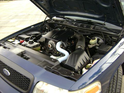 2001 Ford Crown Victoria - Engine bay of a 2001 Ford Crown Victoria, showing the V8 engine and associated components.