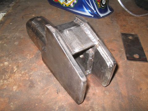 1979 Ford Bronco - Custom welded metal bracket shown on a workbench surface.