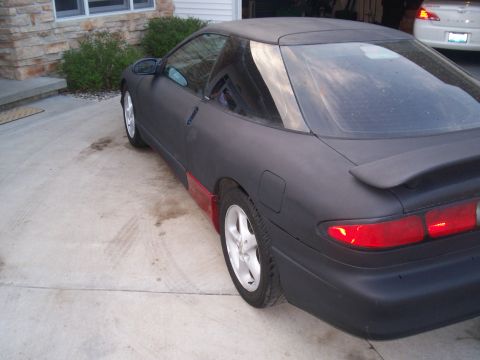 1993 Ford Probe - This 1993 Ford Probe has a matte black finish with contrasting red lower body panels.
