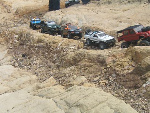 1988 Ford Bronco - RC vehicles navigate a rocky terrain, their off-road capabilities.