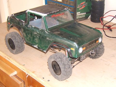 1988 Ford Bronco - This green RC truck body sits on a workbench, ready for its next adventure.