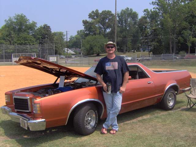 Orange 1979 Ford Ranchero with hood open