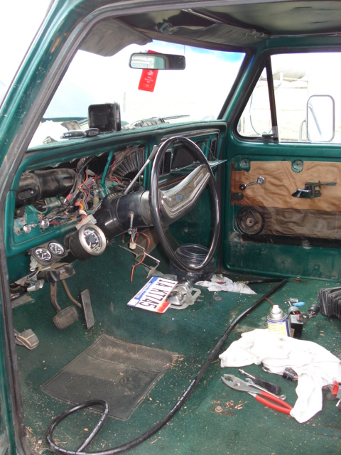 1979 Ford F-150 - The interior of a 1979 Ford F-150 shows a disassembled dashboard with exposed wiring and gauges.