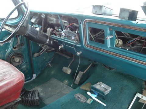 1979 Ford F-150 - The interior of a truck shows a disassembled dashboard with exposed wiring and components.