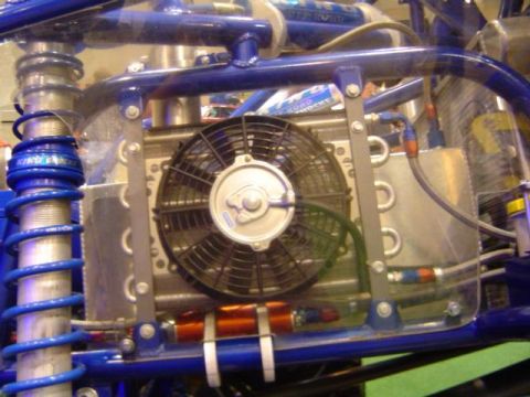 1979 Ford Bronco - Close-up view of an engine cooling fan and radiator, part of a custom build, with visible suspension components.