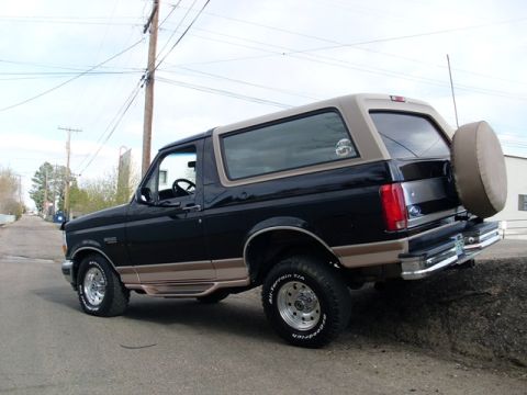 1996 Ford Bronco - This 1996 Ford Bronco is parked on a street with a spare tire mounted on the rear.