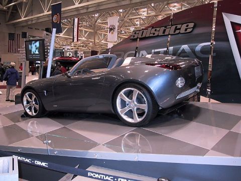 1996 Ford Taurus - A dark gray Pontiac Solstice concept car is displayed at an auto show.