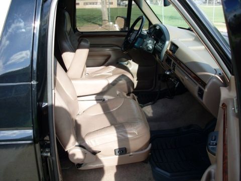 1996 Ford Bronco - Interior view of a 1996 Ford Bronco, tan leather seats and dashboard details.
