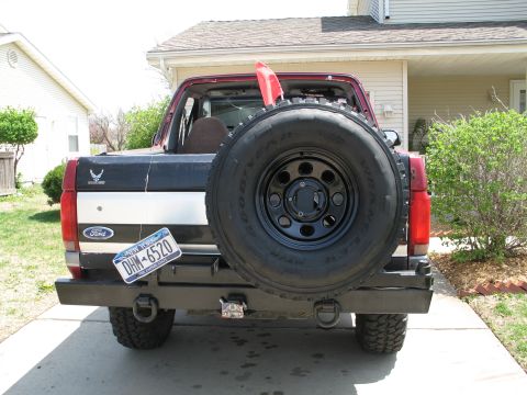 1995 Ford Bronco - Rear view of a 1995 Ford Bronco, showing the spare tire and custom bumper.
