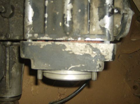 1986 Ford Bronco - A close-up view of a mechanical part, possibly from an engine, showing wear and tear.