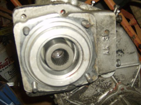 1986 Ford Bronco - A close-up view of a vehicle transfer case component, showing internal splines and stamped markings.