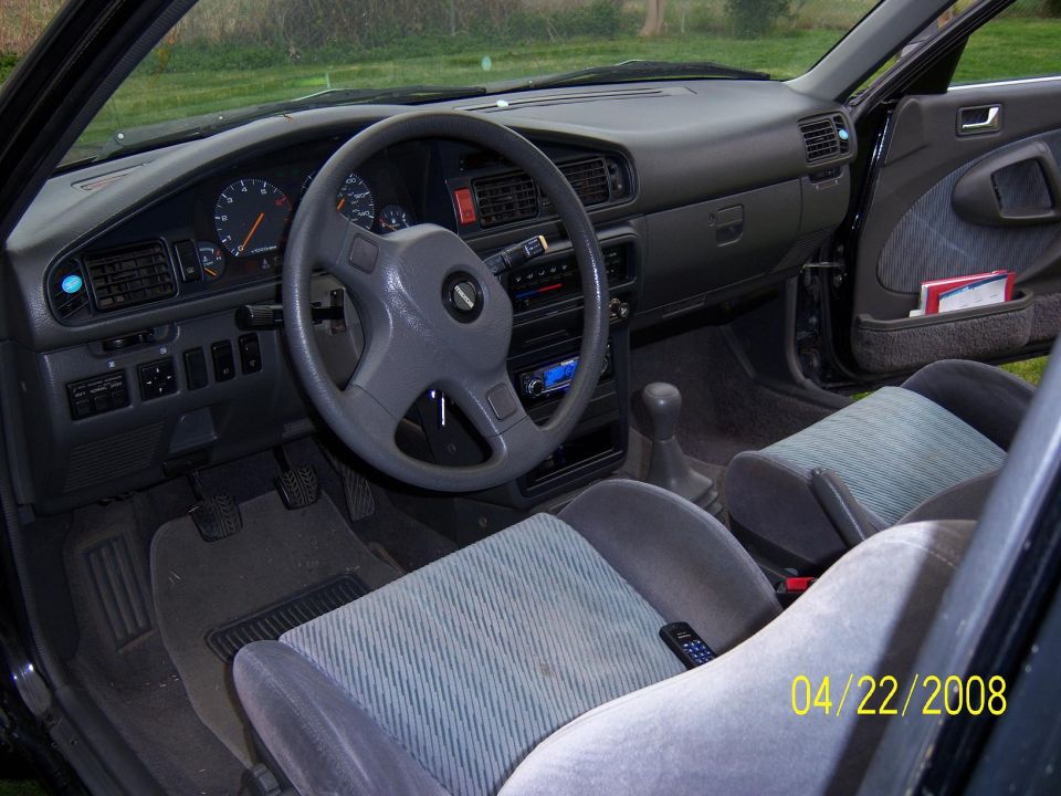 Car interior shot showing dashboard, steering wheel, seats, and gear shift. Date stamp reads 04/22/2008
