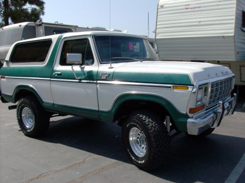 1978 Ford Bronco - This two-tone Ford Bronco is shown from the front three-quarter view, parked outdoors.