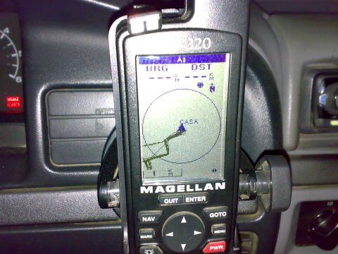 1995 Ford F-150 - Magellan 320 handheld GPS navigation unit mounted on a dash showing a map screen with BRG and DST.
