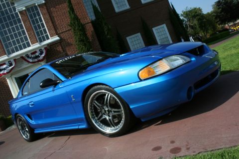 1992 Ford Crown Victoria - Blue 1996 Ford Mustang Cobra with aftermarket wheels.