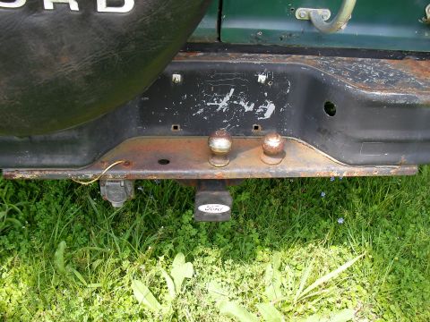 1978 Ford E250 - Rear view of a 1978 Ford E250 showing the bumper, tow hitch, and spare tire cover.