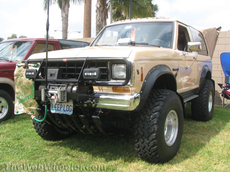 Tan Ford Bronco with winch and off-road tires