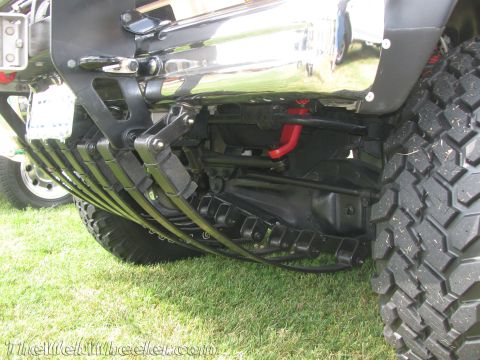 1968 Ford Mustang - Close-up of a truck's rear suspension system, showing leaf springs and differential.