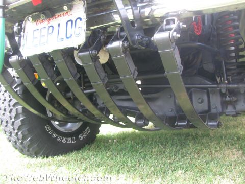 1968 Ford Mustang - The underside of a Jeep shows its rear suspension system, including multiple leaf springs and a differential, with a custom license plate.