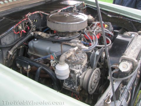 1968 Ford Mustang - Close-up view of a V8 engine bay, showing various components and wiring.