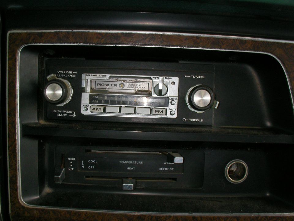 Car interior with Pioneer radio and climate controls