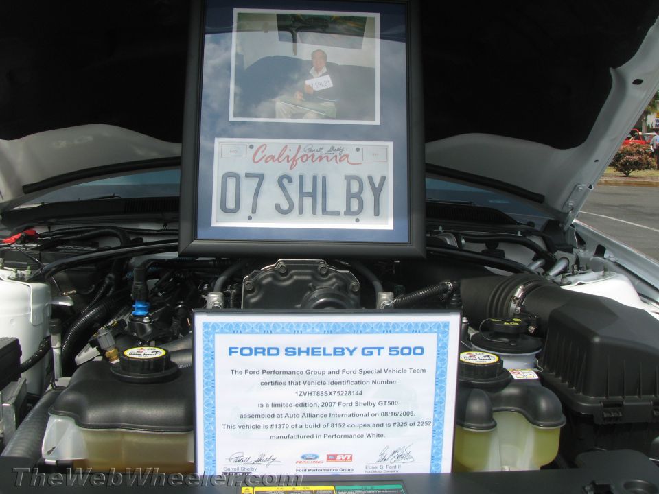 Framed California license plate '07 SHELBY and photo above 2007 Ford Shelby GT500 engine bay with certificate