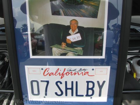1968 Ford Mustang - A framed display includes a photograph of a man and a California license plate with '07 SHELBY' on it.