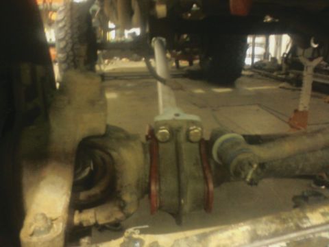 1992 Ford F-350 - Close-up of a vehicle's suspension system, showing mechanical parts and hardware.