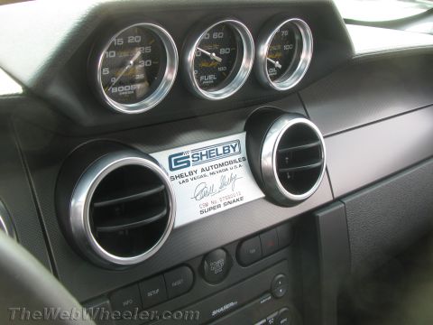 1968 Ford Mustang - The interior of a Shelby Super Snake features custom gauges and badging, indicating a high-performance vehicle.