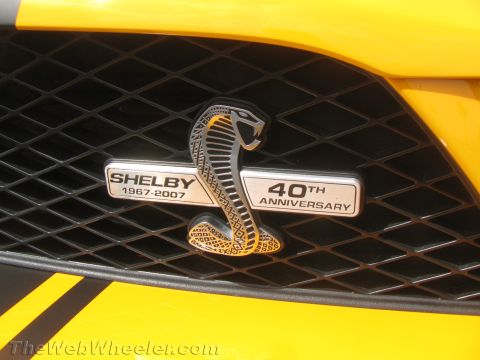 1968 Ford Mustang - Close-up of a Shelby 40th Anniversary badge on a car's front grille, indicating 2007.