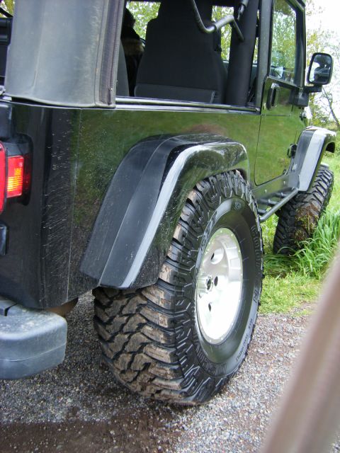 2005 Jeep Wrangler - The flares aren't the problem, it's hitting the tub too. I looked at the stops, they are two inches from touching in back.