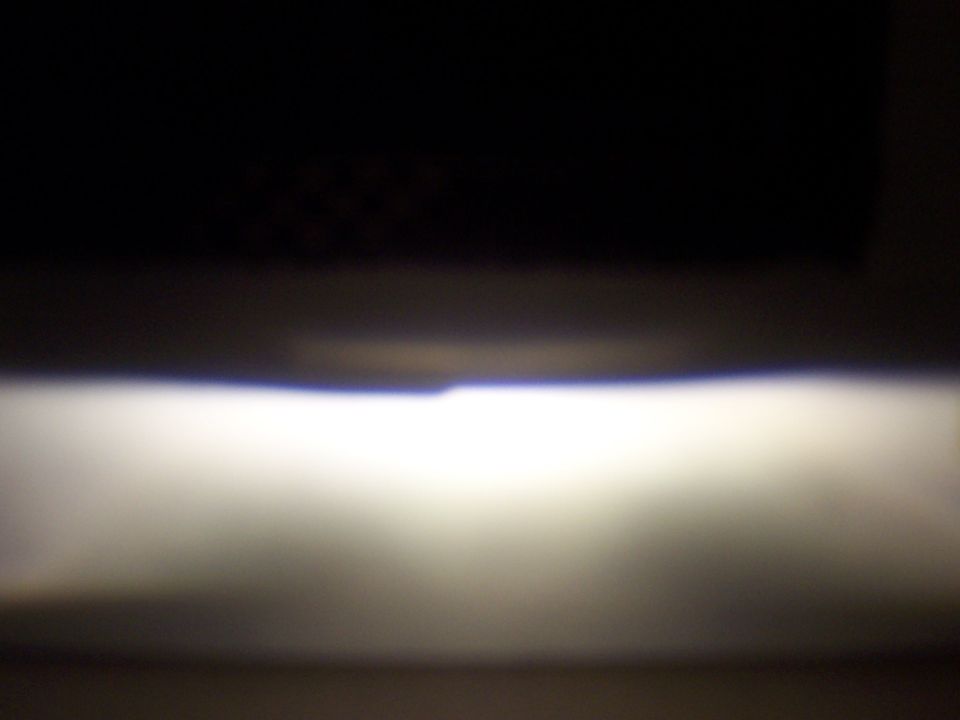 Headlight beam with SUPERMOTORS.NET watermark